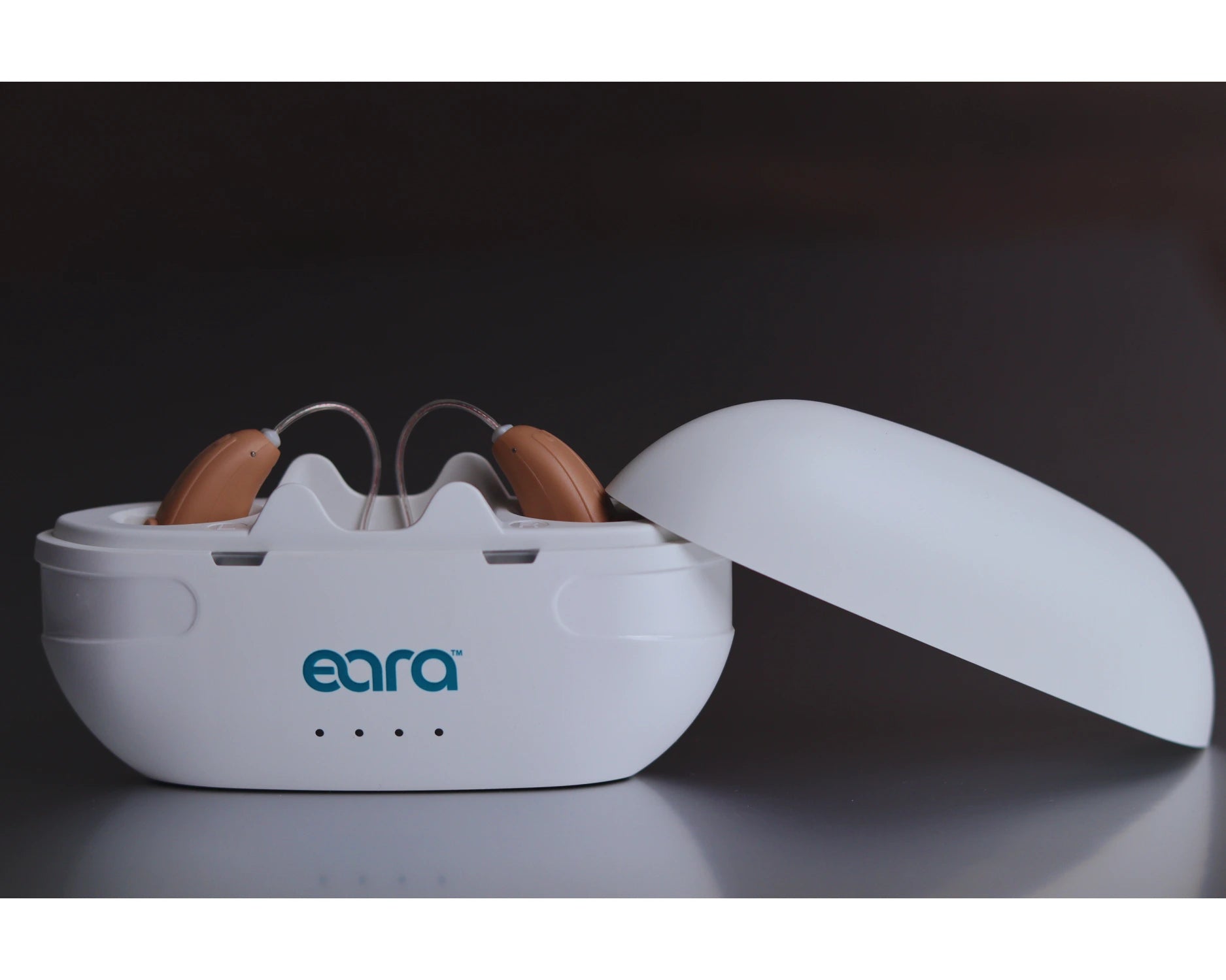 Explore Li+ Portable charger with Explore Li+ OTC Bluetooth hearing aids inside charging on-the-go.