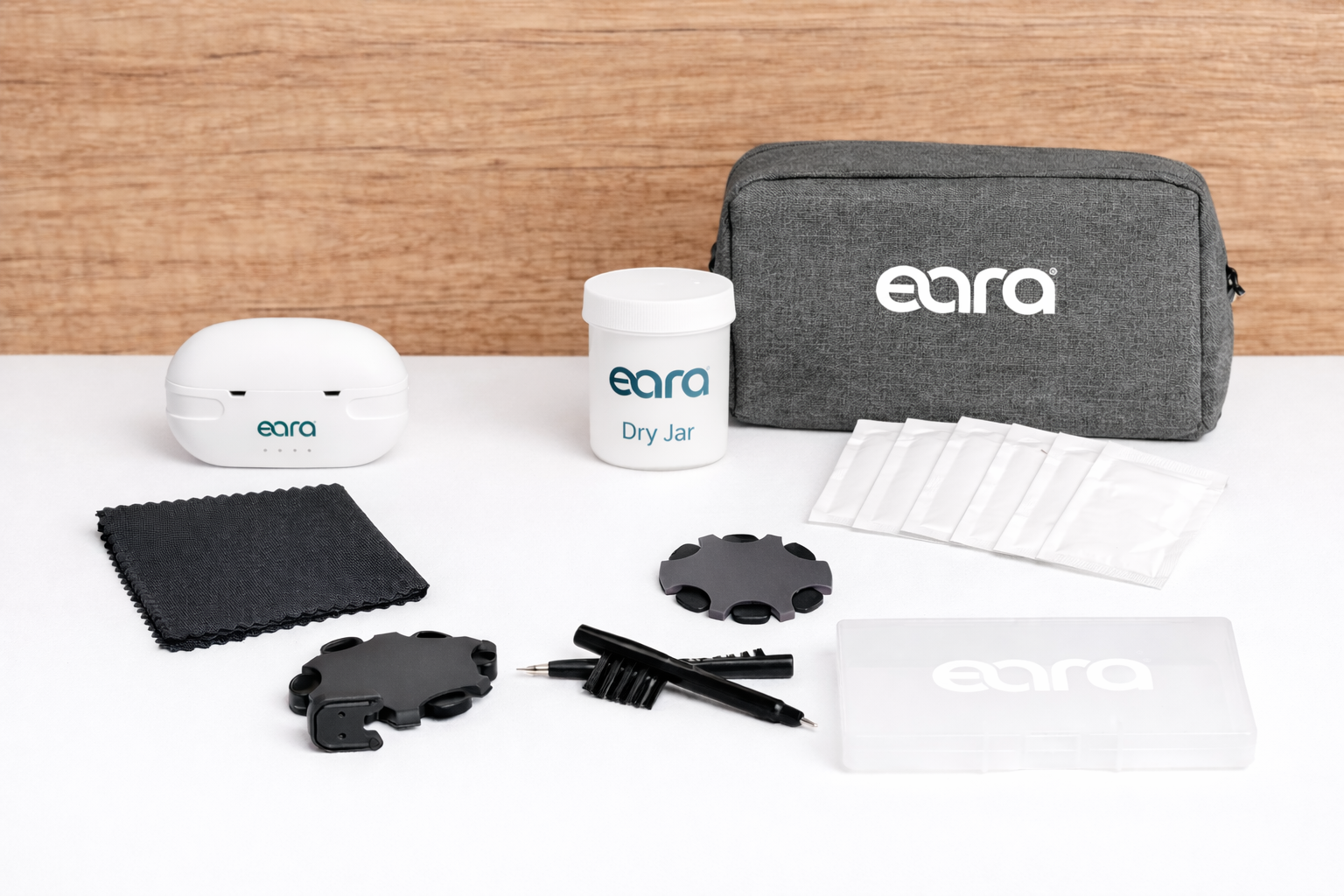 Eara ear care kit with various items on a white surface against a wooden background