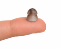 eara size 4 large power dome on fingertip
