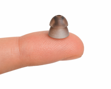 eara size 4 large power dome on fingertip