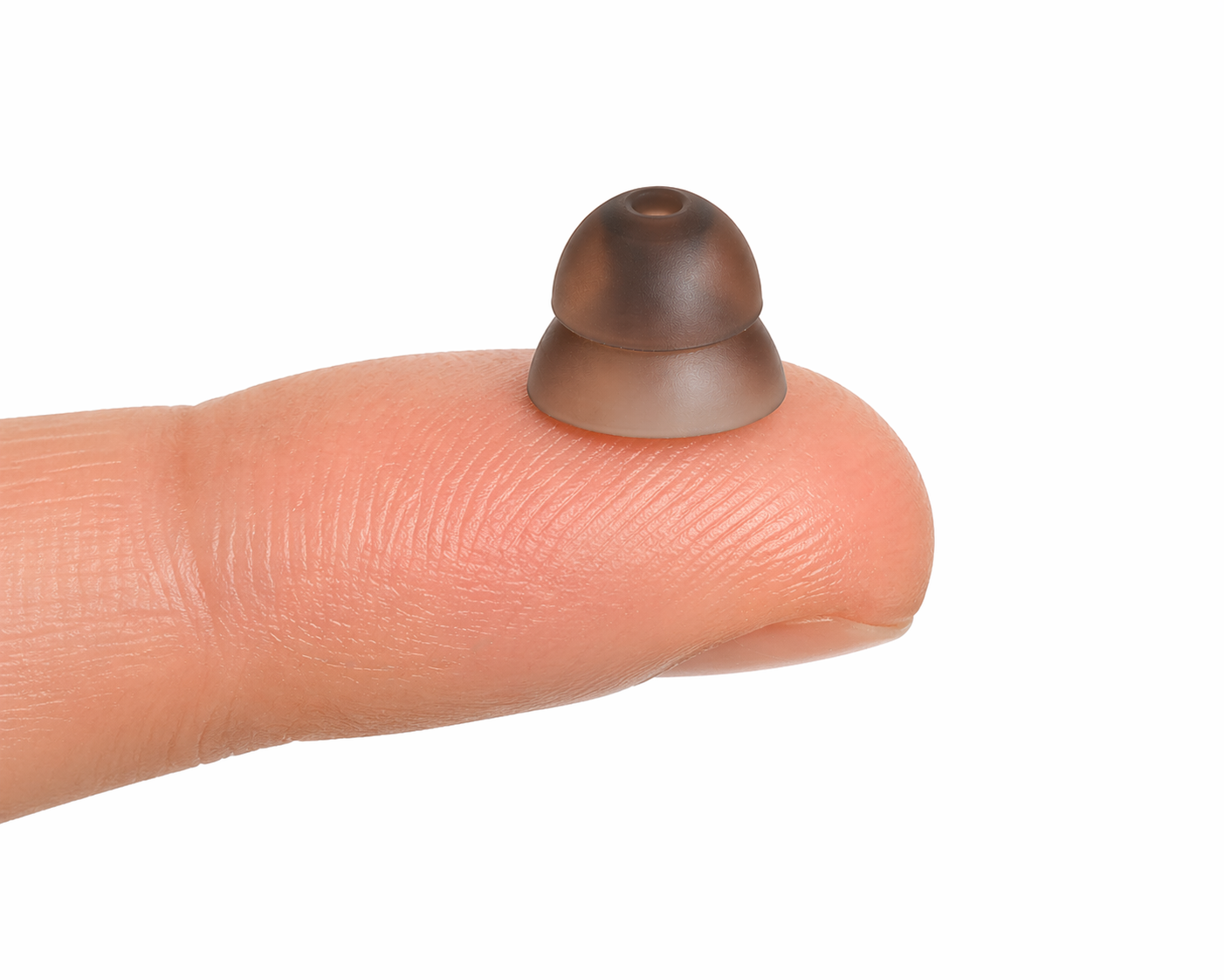 Eara size 5 extra large dome on a person's finger against a white background