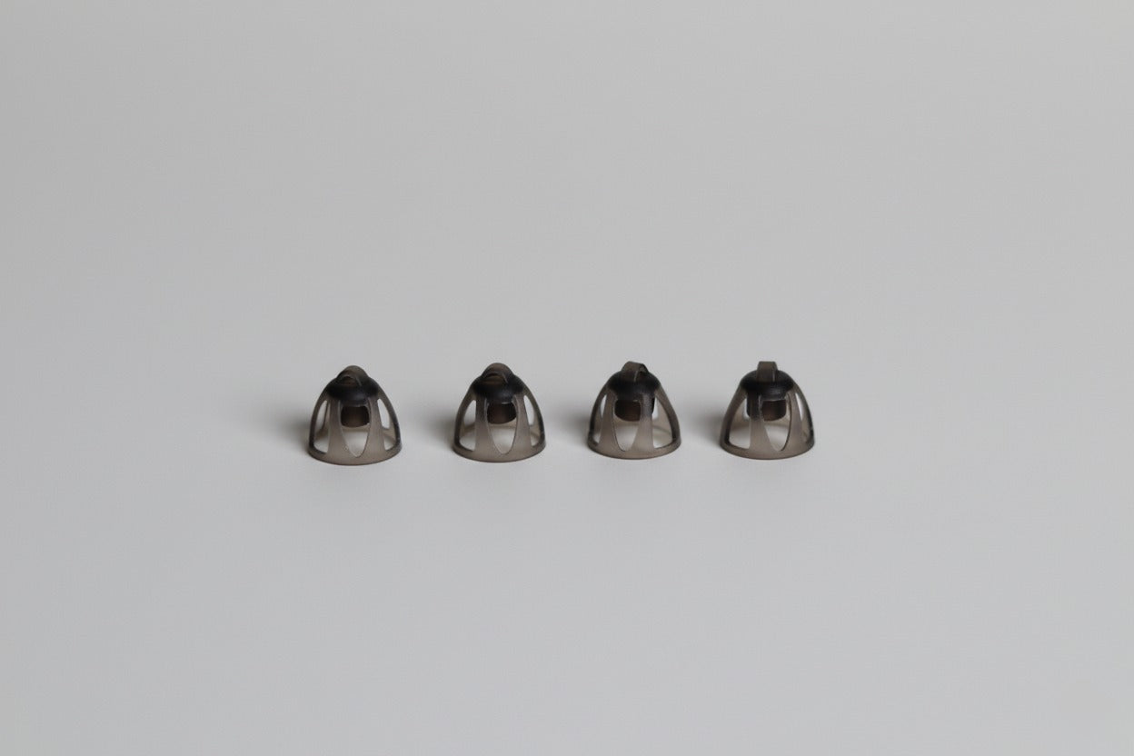 four small open domes on a light grey background